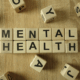 wood blocks that spell out mental health