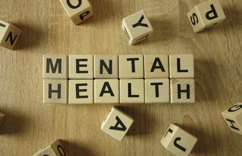 wood blocks that spell out mental health
