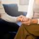 Two women holding hands
